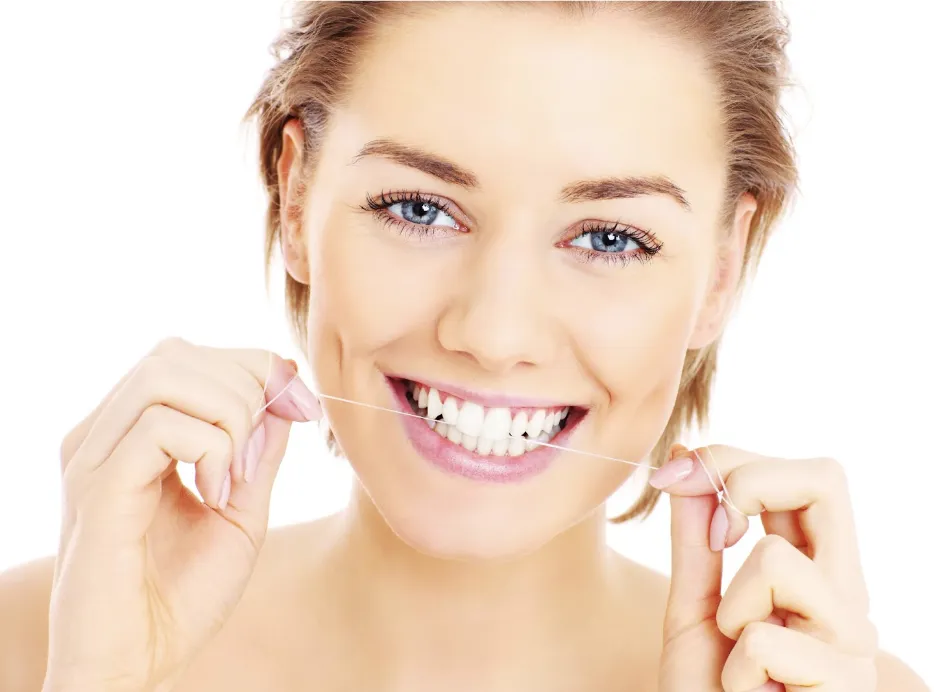 Smiling patient with healthy teeth flossing