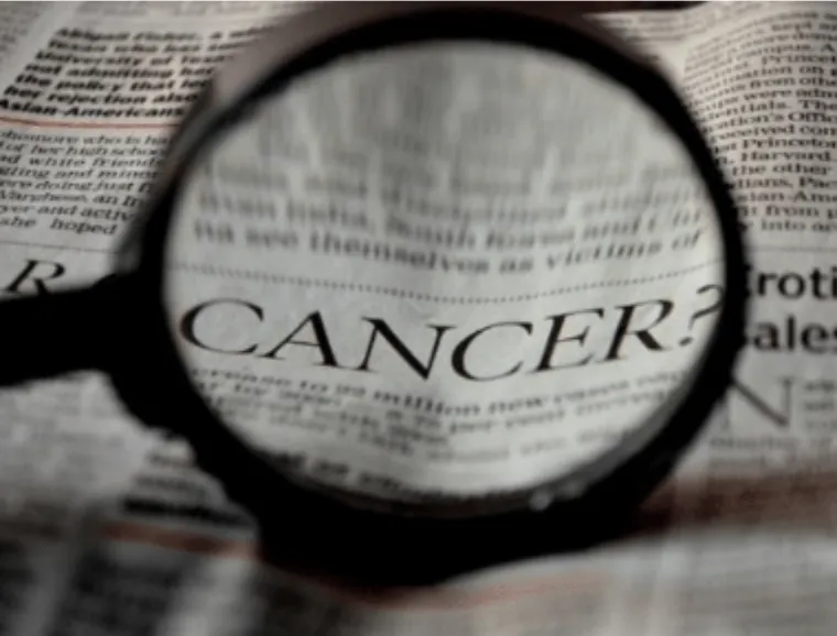 Magnifying glass highlighting oral cancer awareness