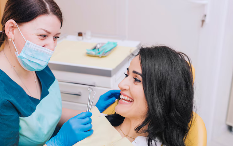 Dentist consulting with patient about restorative dentistry