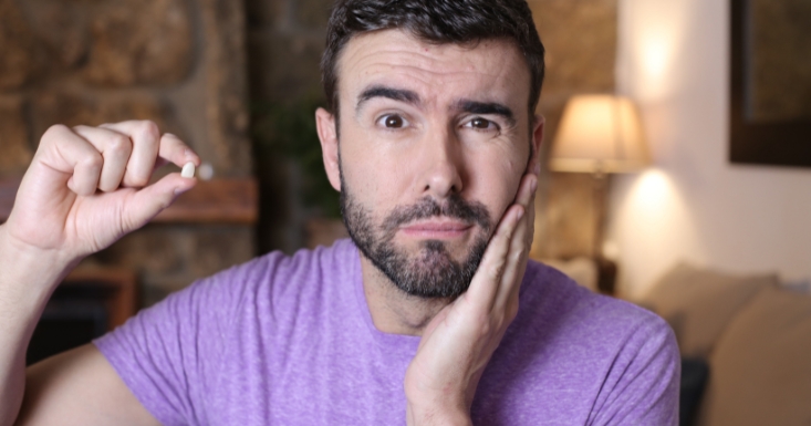 Man reacting to a missing tooth emergency