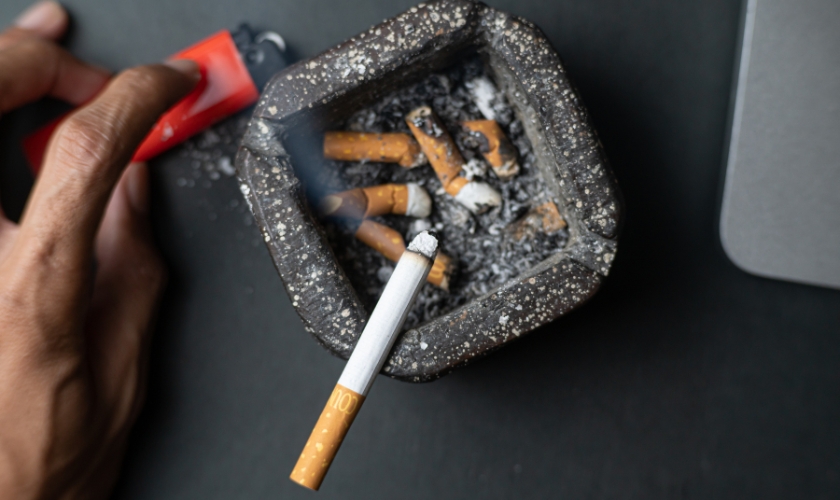 Discarded cigarette butts promoting oral health awareness
