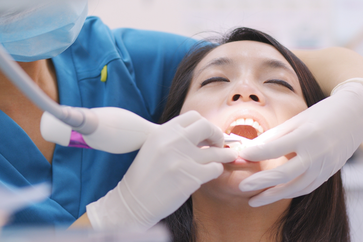 Patient receiving dental treatment in a modern office