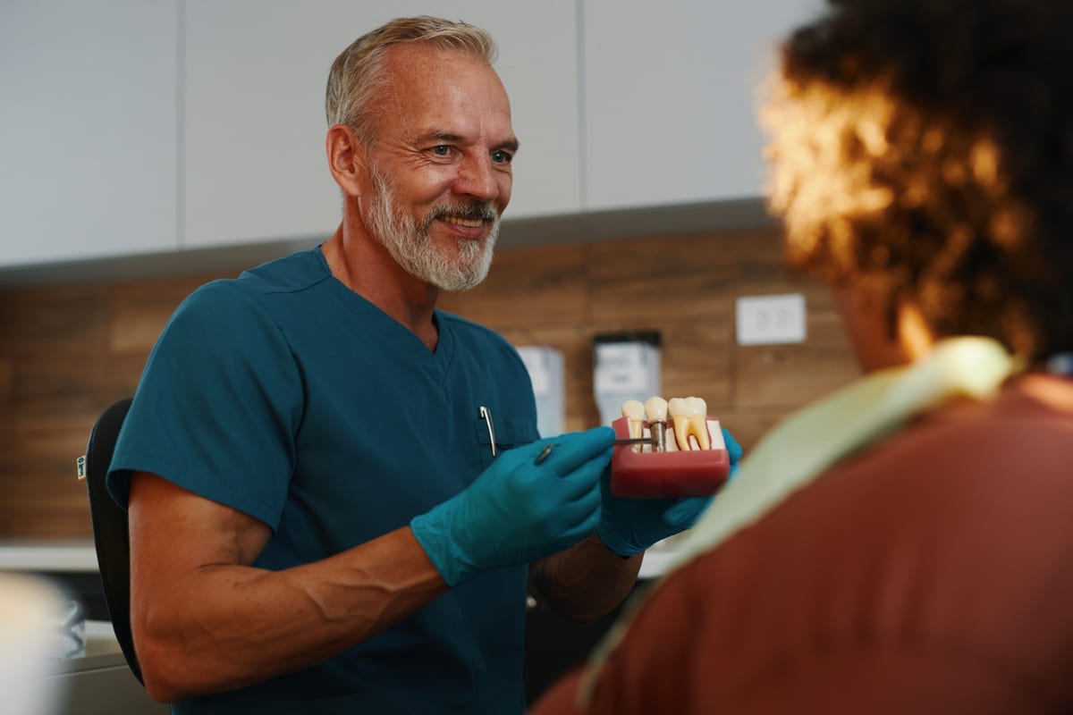 Dentist speaking with a patient