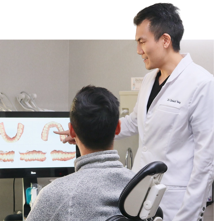 Dr Yang showing report to a patient